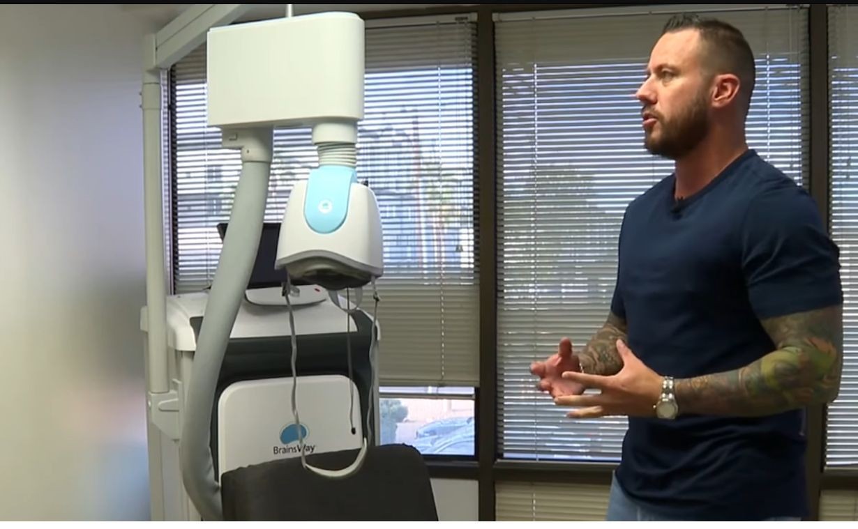 Dr. Robbie Westerman discussing TMS treatment equipment